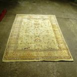 A large cream ground Persian design carpet, 310cm x 243cm (Viewing by appointment only as this rug