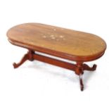 A modern Indian hardwood oval coffee table, with brass and copper floral inlay, L121cm, H45cm, D56cm