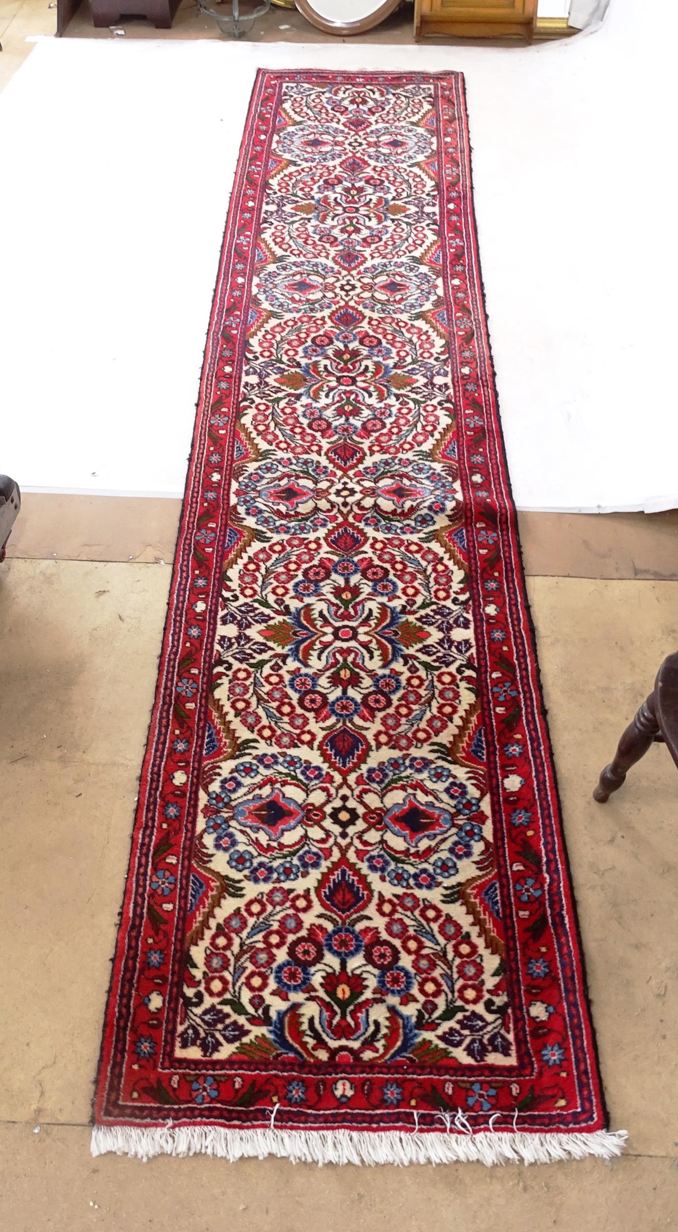 A red ground Persian design runner, 395cm x 78cm - Image 2 of 2