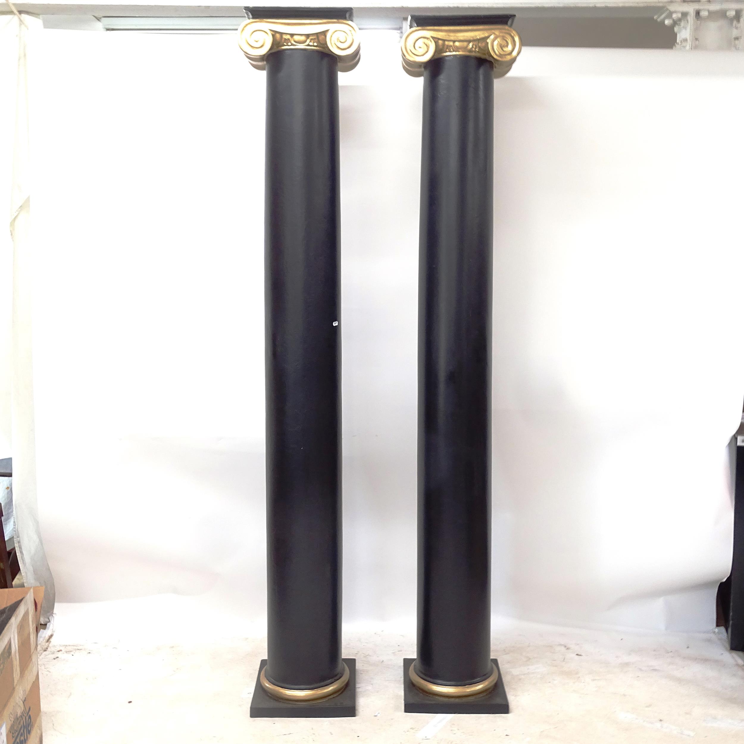 A pair of fibreglass Ionic columns painted in black and gold, H229cm - Image 2 of 2