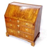 An Antique walnut bureau, the crossbanded fall-front revealing a fitted interior with well, 2 long