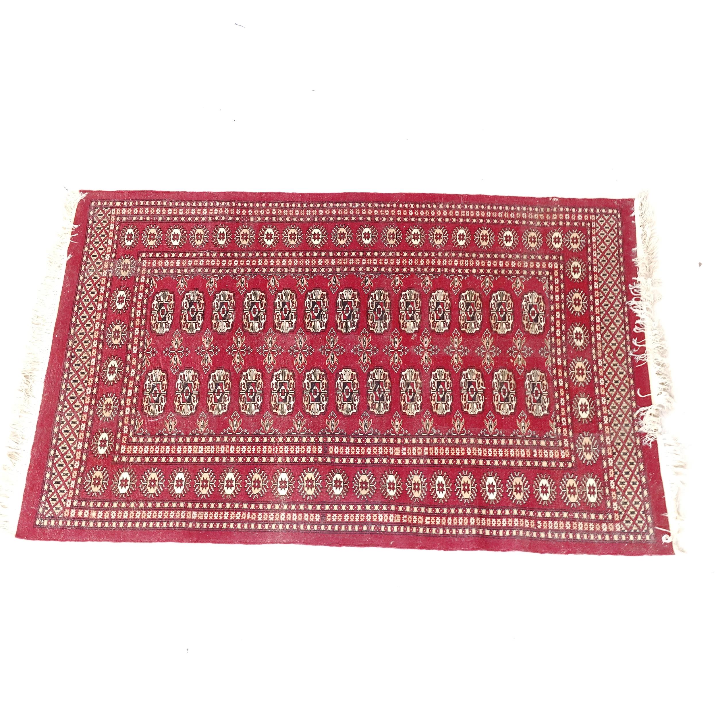 A red ground Tekke design rug, 155cm x 97cm - Image 2 of 2