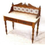 An Art Nouveau pine washstand, with raised tile back, marble top and 2 frieze drawers, W107cm,