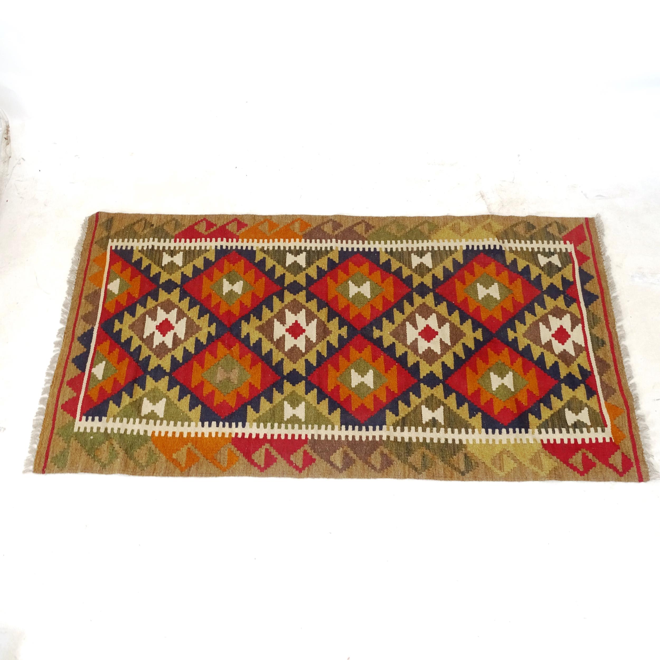 A Mamainer red ground Kilim runner, 193cm x 101cm