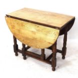 An oak gateleg table on barley twist legs, W90cm, H73cm, overall length 123cm