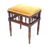 An Antique mahogany spindle turned rectangular upholstered piano stool