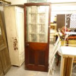 A stained panelled wood door, with inset scrolled decorated glass panel, W70cm, H88cm