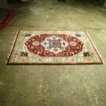 A red ground Indian Herize carpet, 292cm x 198cm (Viewing by appointment only as this rug is not