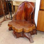 A stained rootwood chair