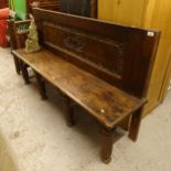 A carved and panelled oak bench, on fluted legs in Gothic style, L172cm, H99cm, seat height 50cm