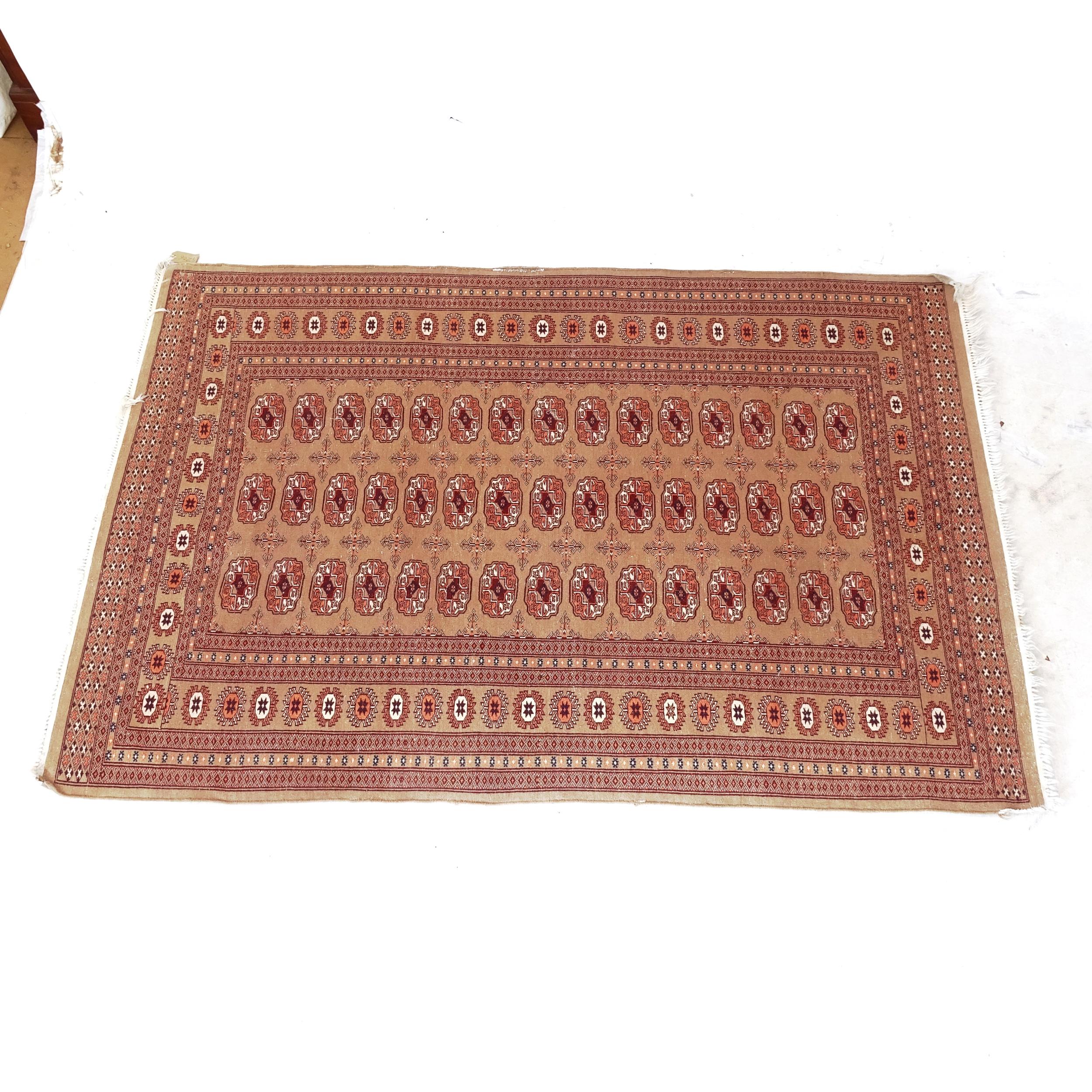 A Tekke design rug, with symmetrical border, 187cm x 126cm - Image 2 of 2