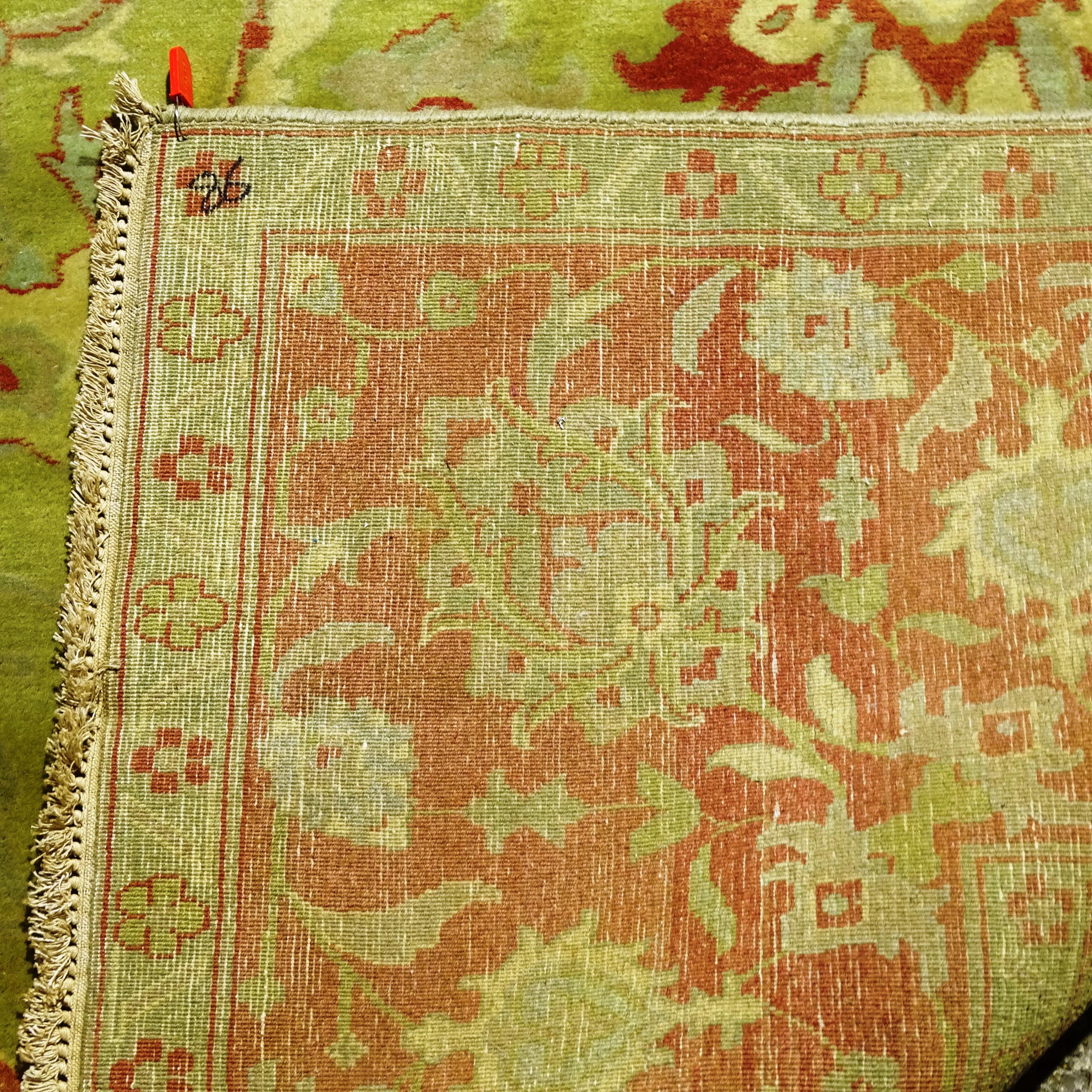 A large green ground Persian design carpet, with red border, 350cm x 270cm (Viewing by appointment - Image 2 of 2