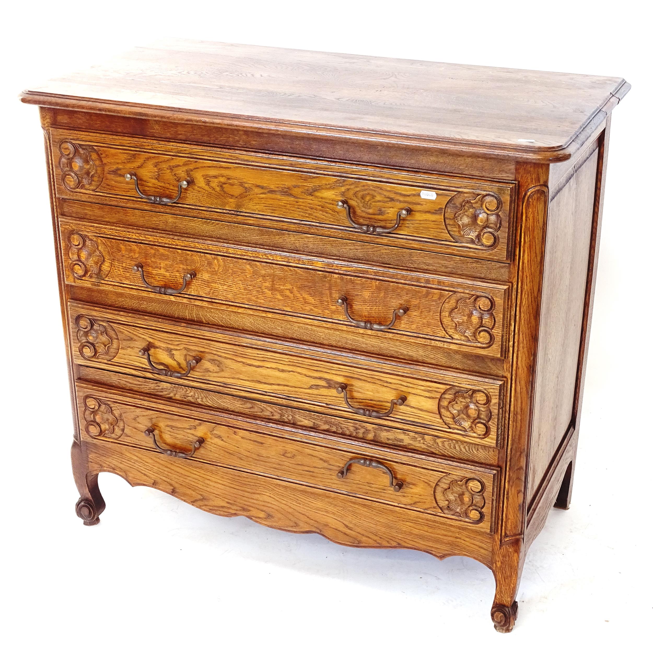 A French oak chest of 4 long drawers with carved decoration, W98cm, H90cm, D51cm