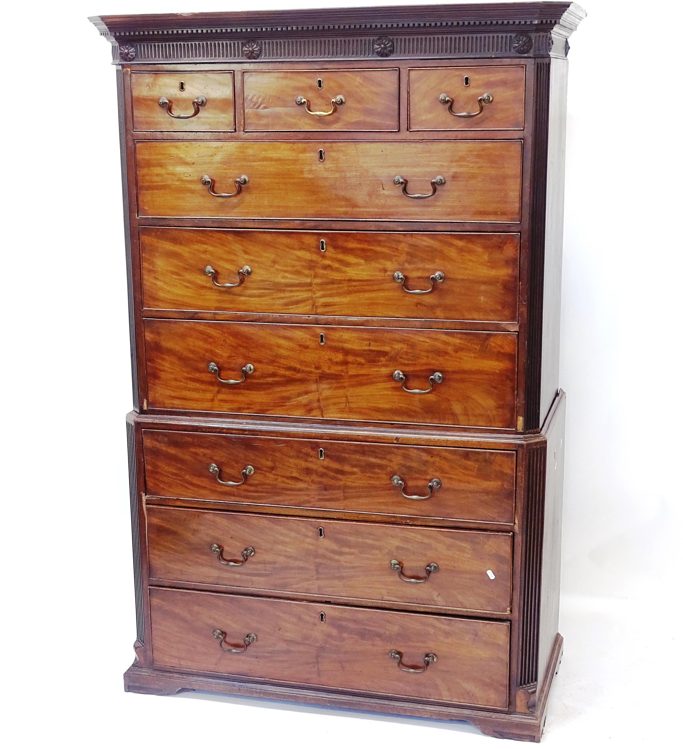 A Georgian mahogany 2-section chest on chest, with 3 short and 6 long drawers, on bracket feet,