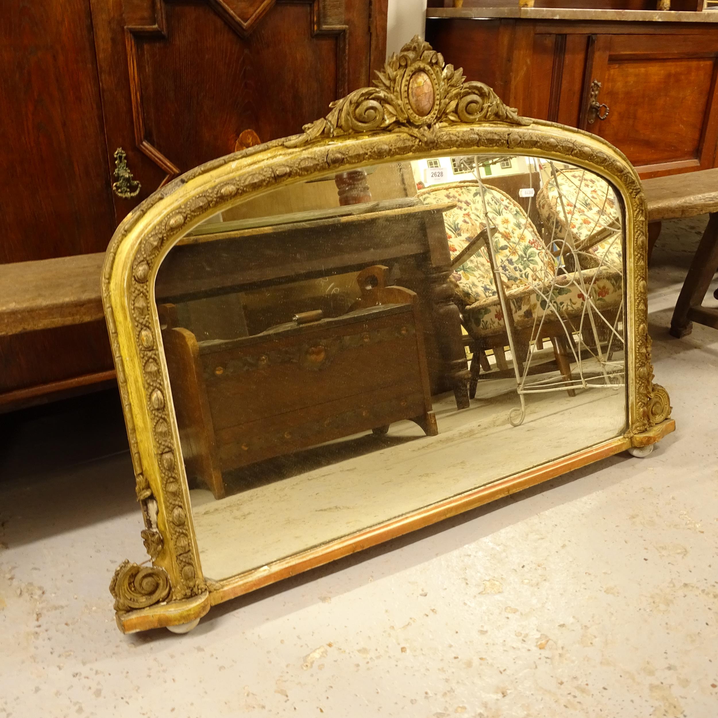 A 19th century painted and gesso-framed arch-top over mantel mirror, W104cm, H74cm