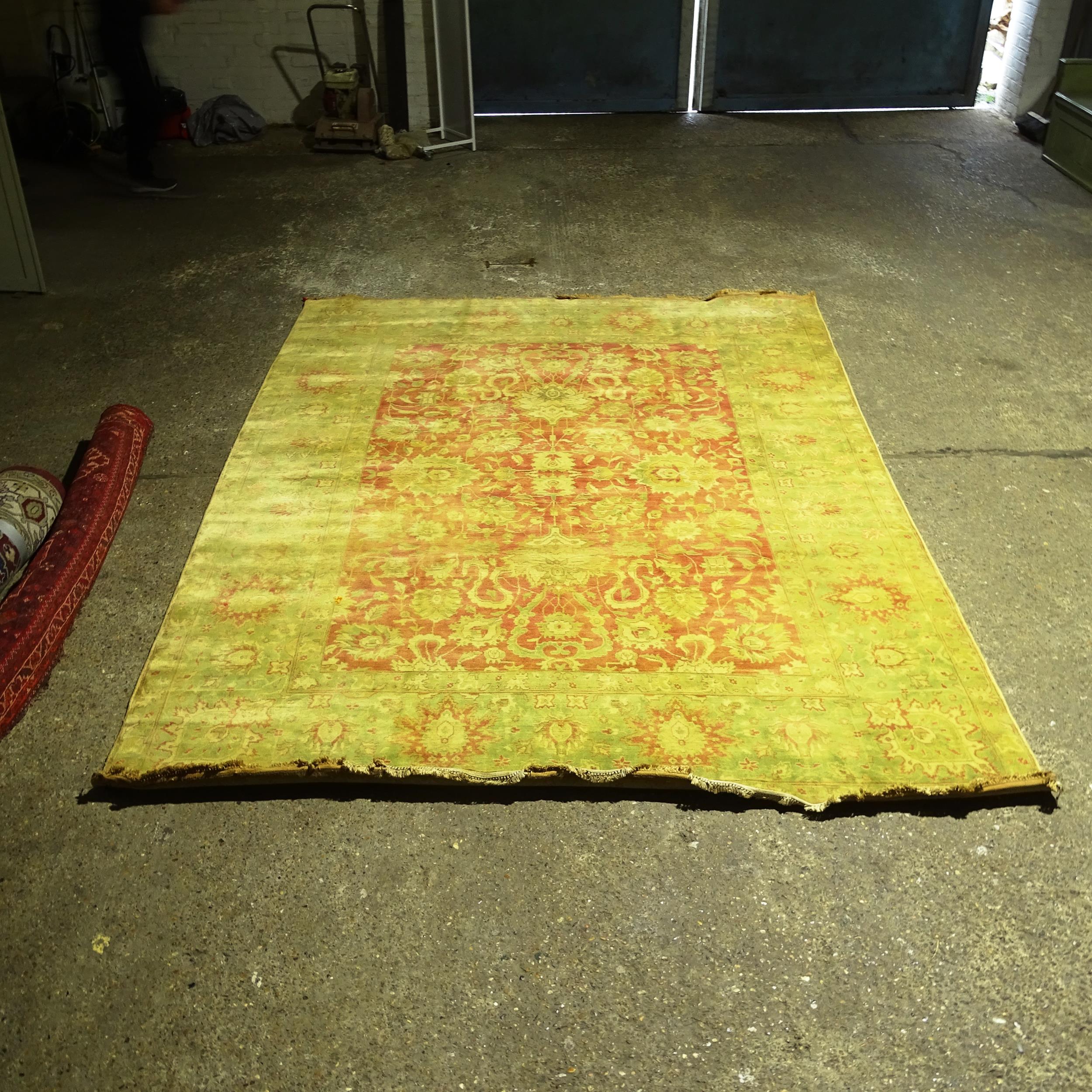 A large green ground Persian design carpet, 360cm x 260cm (Viewing by appointment only as this rug