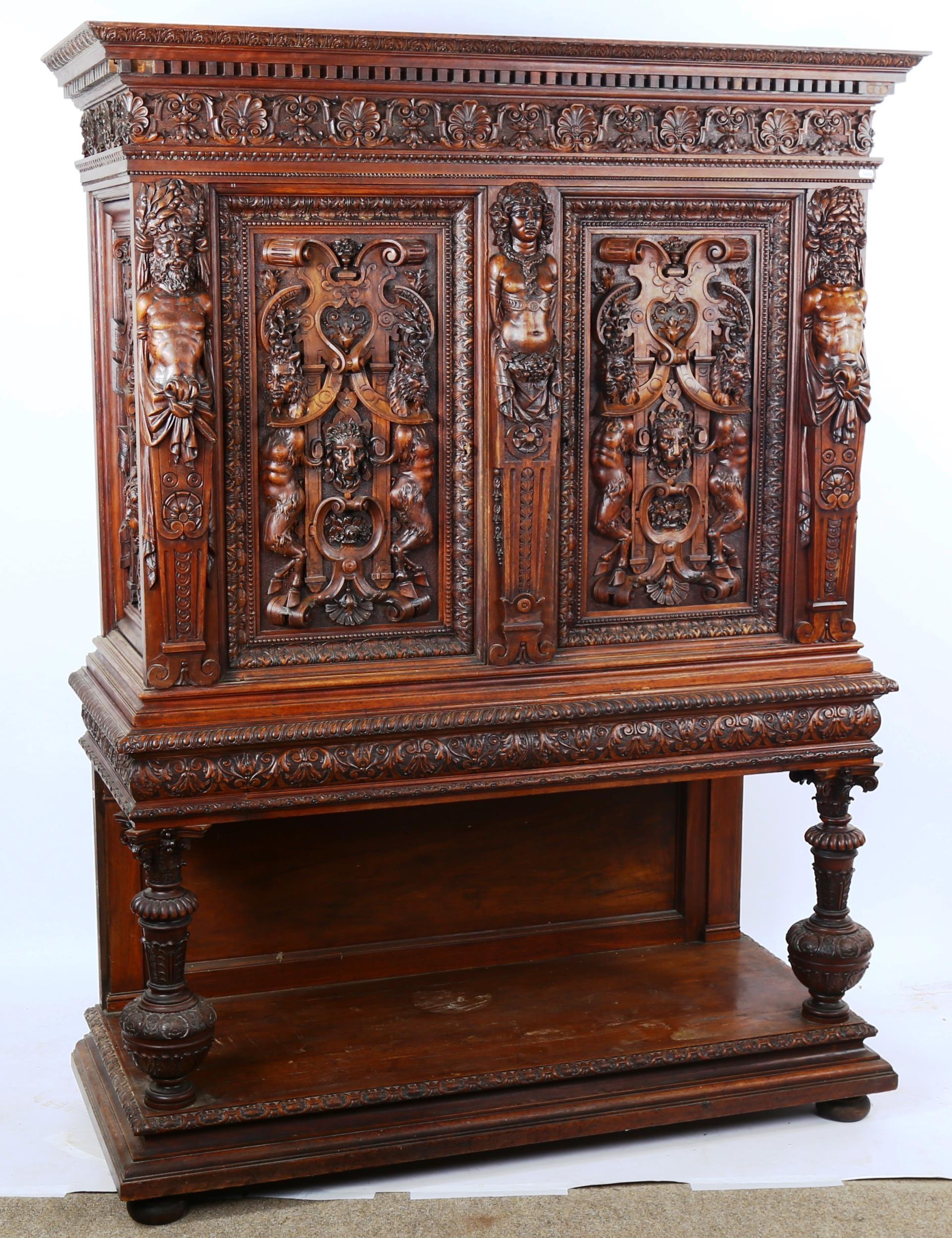 An impressive 19th century Neo-Classical design walnut 2-door cupboard, the 2 finely carved and