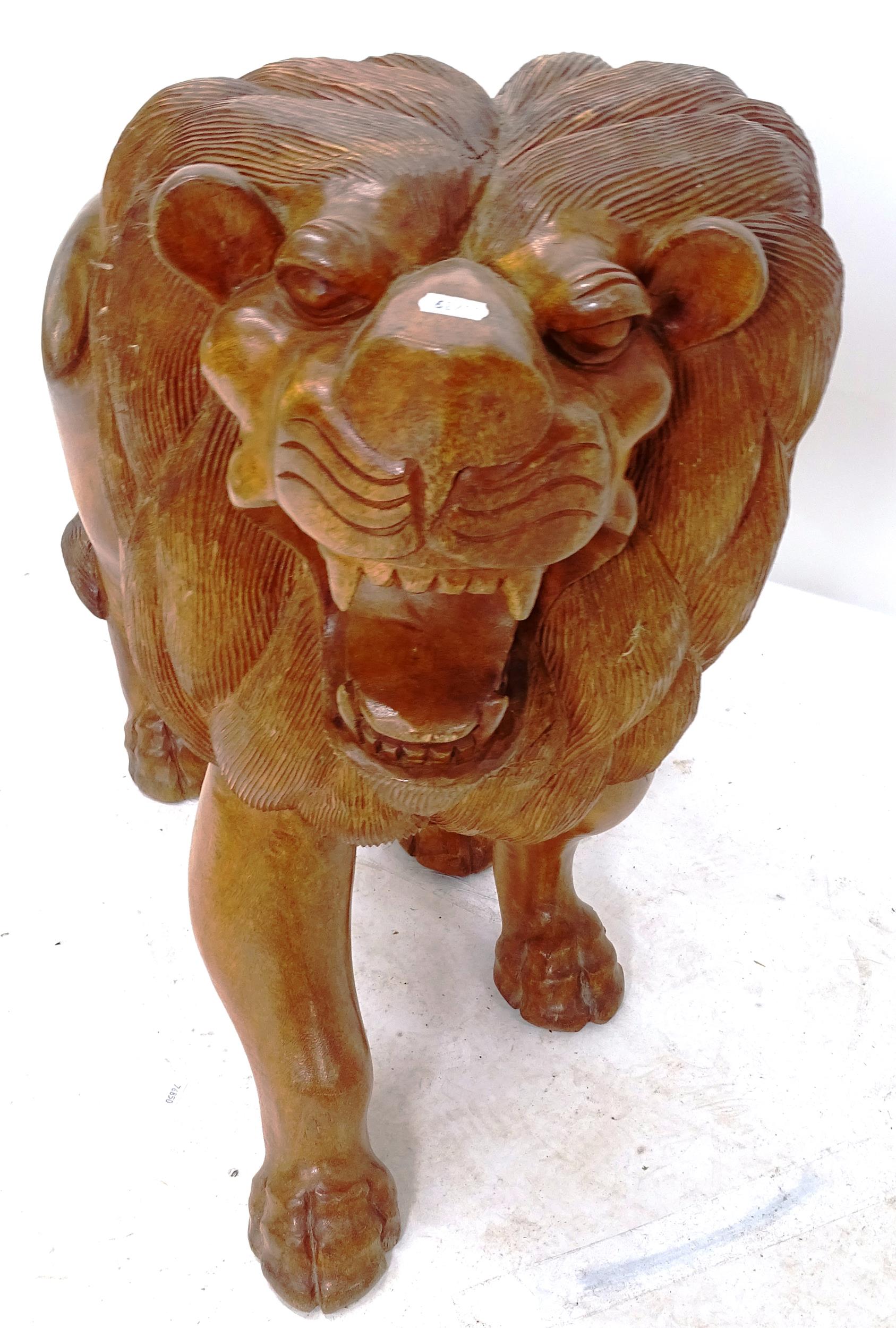 A carved hardwood study of a lion, length 90cm, H77cm - Image 2 of 2
