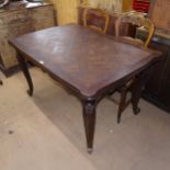 A French stained oak parquetry-top draw leaf dining table, L130cm extending to 220cm, H76cm, D90cm