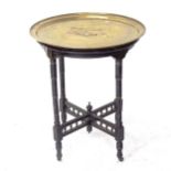 A Victorian circular brass-topped occasional table, on ebonised base, D62cm, H75cm