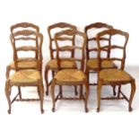 A set of 6 French rush-seat ladder-back dining chairs