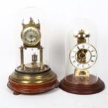 A reproduction brass skeleton clock under glass dome, and a 400-day clock under glass dome,