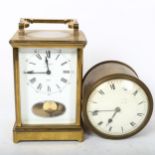 A reproduction brass-cased carriage clock, by Estyma, and a brass-cased drum clock, diameter 10cm (