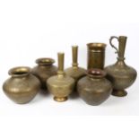 A group of Middle Eastern brass vases, largest height 30cm (7)