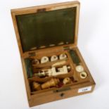 A 19th century rosewood and satinwood sewing workbox, with original ivory clamps and reels