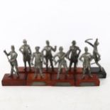 A set of 8 pewter military figures, on wooden stands, height 14cm approx