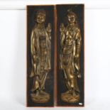 A pair of relief embossed brass figural Buddhist plaques, 84cm x 24cm