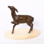 An Art Deco patinated spelter fawn sculpture, unsigned, on alabaster base, length 24cm, height 20cm