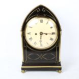 An ebonised lancet-top 8-day bracket clock, cream dial with Roman numeral hour markers, and lion