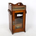 A small early 20th century oak table-top smoker's cabinet, height 33cm