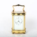 A reproduction shaped brass carriage clock, by Tandridge, case height 12cm, not currently working