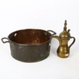 A 19th century copper jam pan, and a Turkish brass ewer, height 26cm (2)