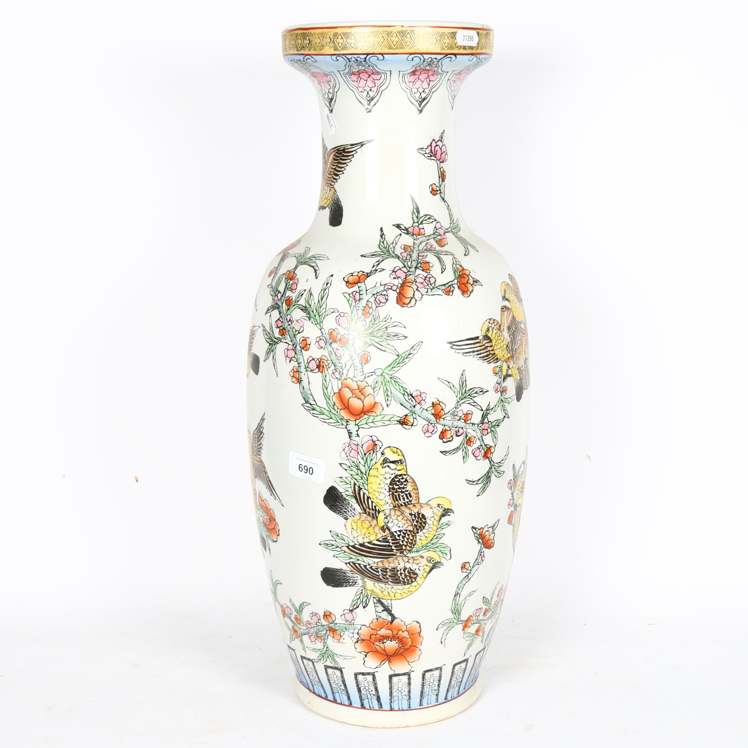 A large Oriental ceramic vase decorated with birds and blossom, 60cm