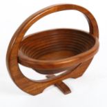 A mid-century teak collapsible basket, height 30cm, length 38cm