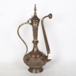 A large Middle Eastern silver plated copper ewer, allover engraved decoration, height 50cm