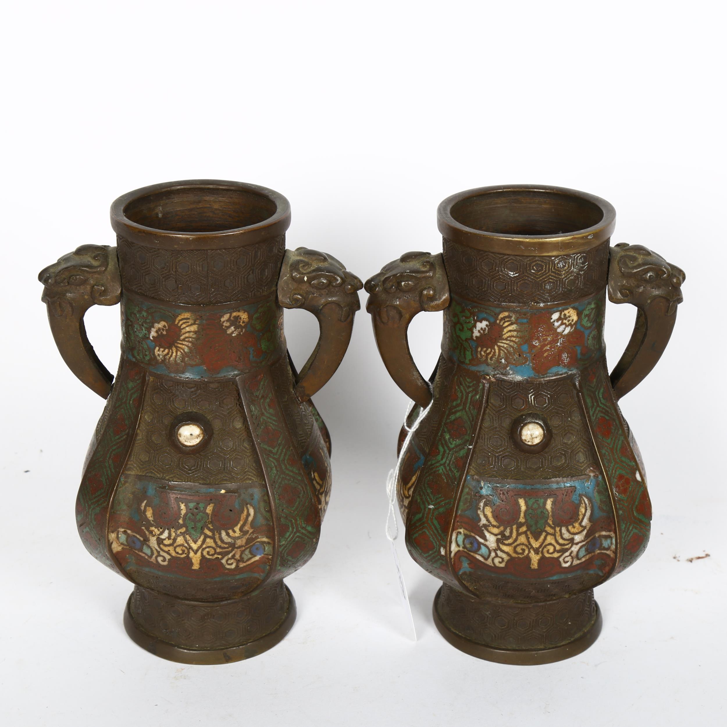 A pair of Oriental bronze vases with enamelled decoration, 18cm