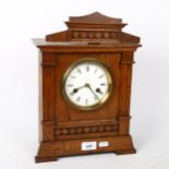 An early 20th century Hamburg American Clock Co oak 8-day mantel clock, 14-day strike, case height