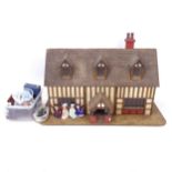 A large and impressive handmade wooden doll's house, L120cm, H75cm, D60cm, together with 4 porcelain