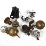 A collection of bicycle bells, and a blackout lamp