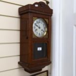 A Vintage stained oak 8-day drop-dial wall clock, case height 55cm, with pendulum