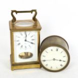 A reproduction brass-cased carriage clock, by Estyma, and a brass-cased drum clock, diameter 10cm (