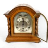 A Charlwoods 8-day striking mantel clock, with barley twist columns, 32cm Clock is not currently