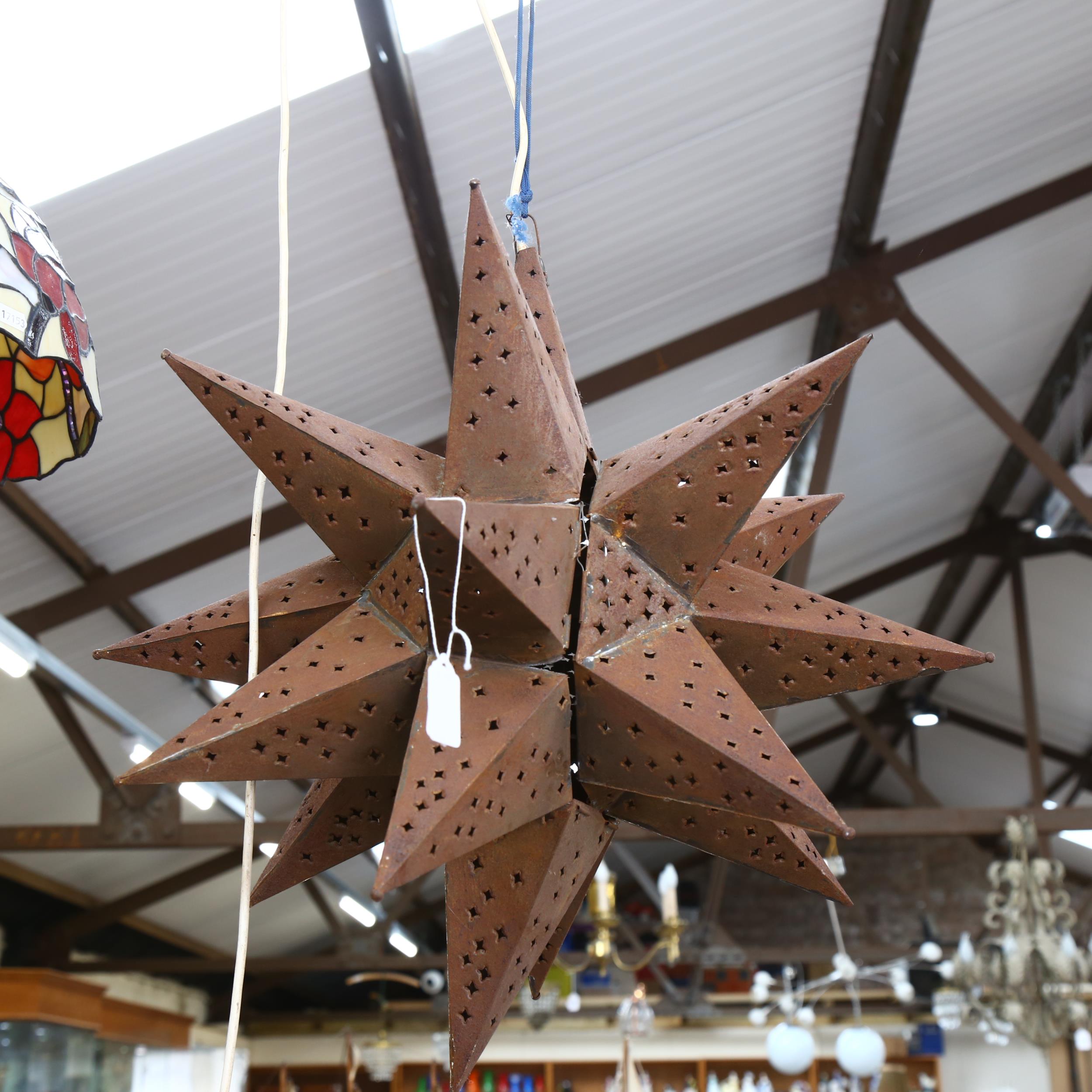 A weathered tin starburst light fitting, height 60cm