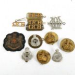 Various military badges, including Queen Mary's Own