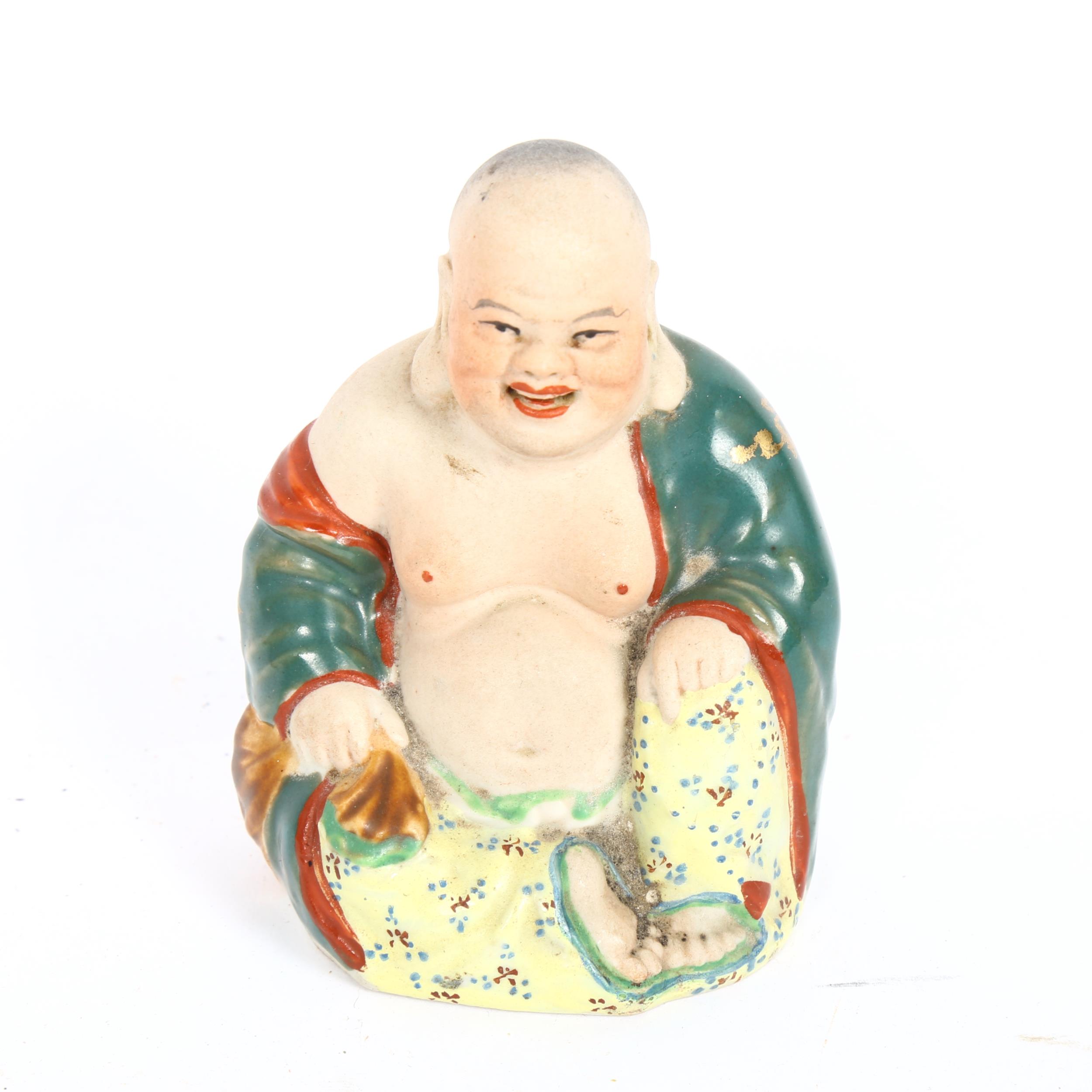 A Chinese porcelain seated Buddha, impressed marks under base, height 8cm No chips cracks or