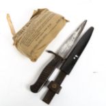 A First World War Period German fighting knife and scabbard, blade length 14cm, and a Second War